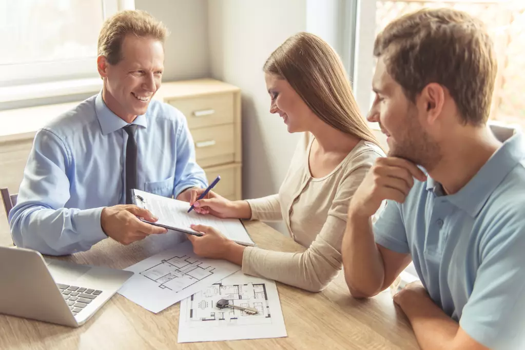 Couple visiting realtor